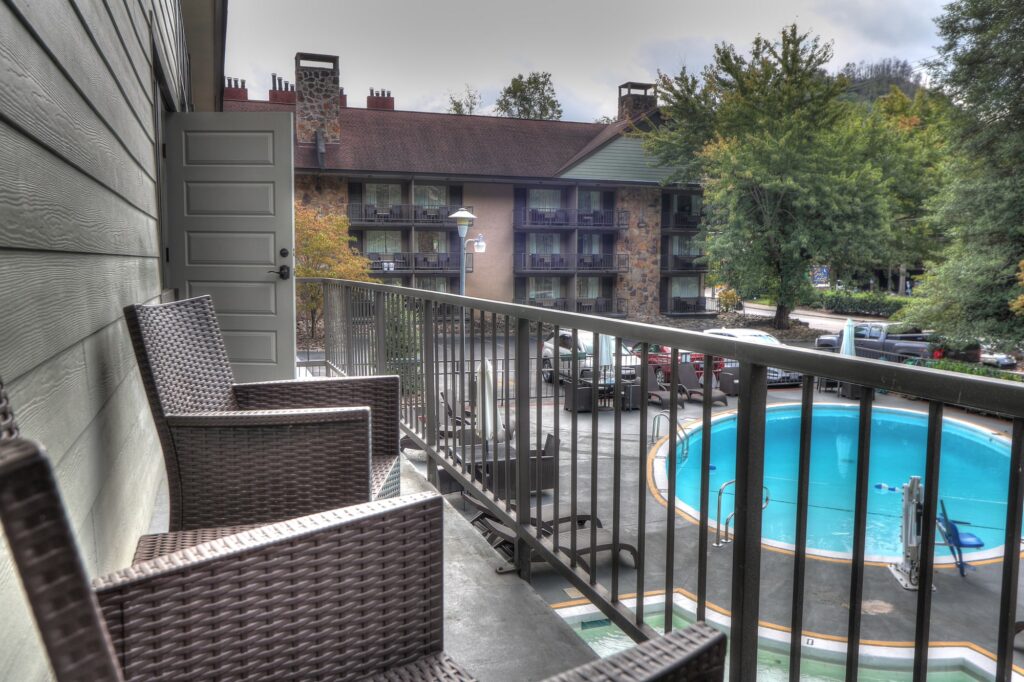 Private balcony view overlooking the pool at River Edge Inn
