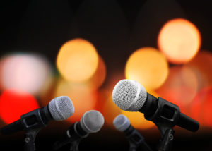 Four microphones on stage
