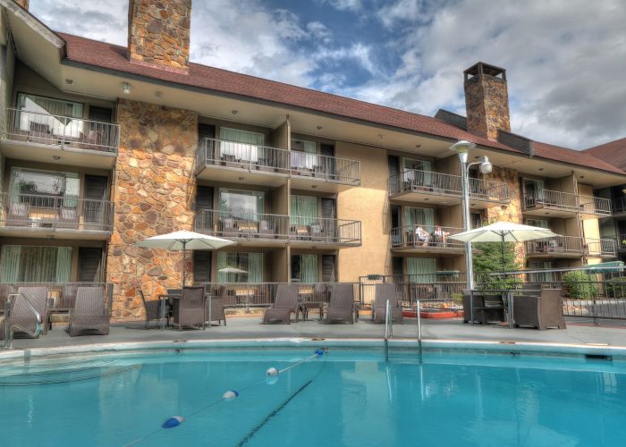 Guest balconies overlooking the seasonal pool at River Edge Inn
