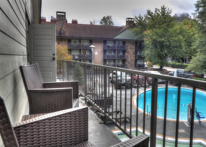 Private balcony view overlooking the pool at River Edge Inn