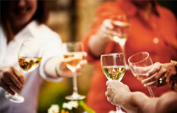 wines glasses raised for toast